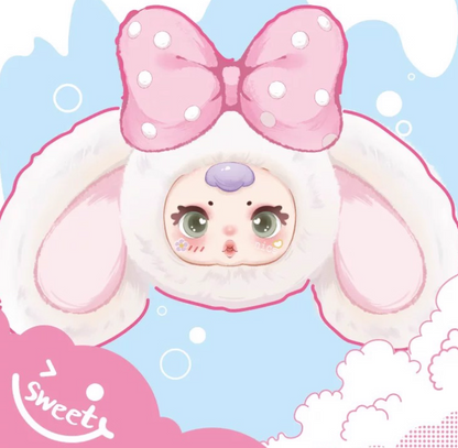 Close-up of MM Sugar Baby Bunny plush with random facial expression and candy scented face
